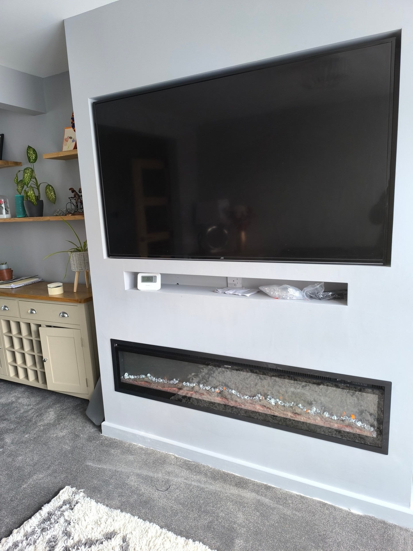 Finished media wall with fireplace and TV